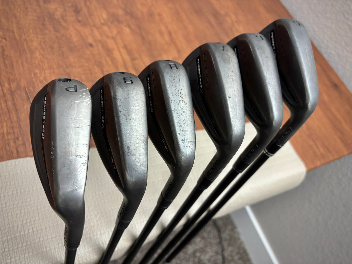 (+1”) Cobra King Forged TEC X Black Iron Set 5-PW / Regular Flex Graphite