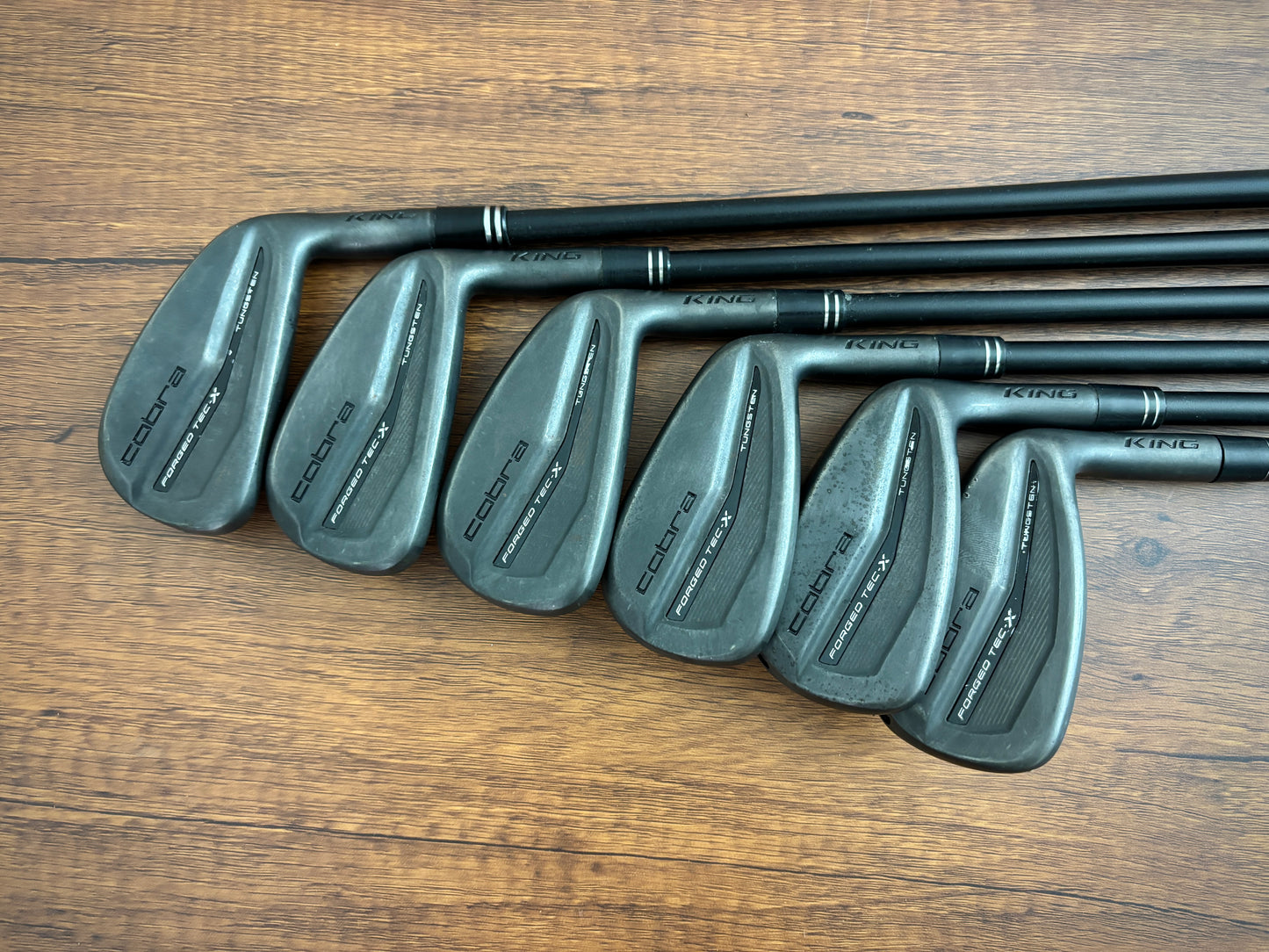 (+1”) Cobra King Forged TEC X Black Iron Set 5-PW / Regular Flex Graphite