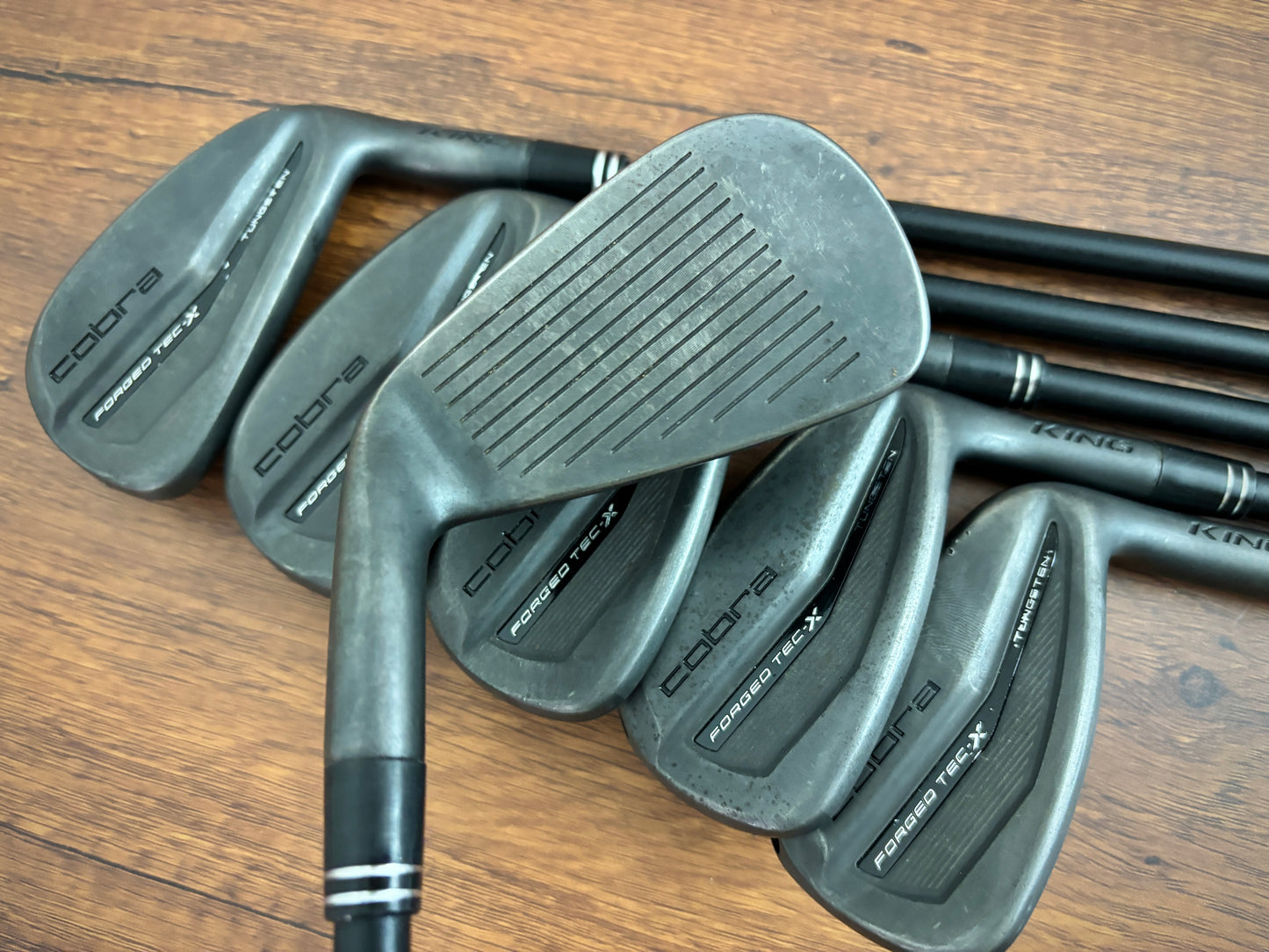 (+1”) Cobra King Forged TEC X Black Iron Set 5-PW / Regular Flex Graphite